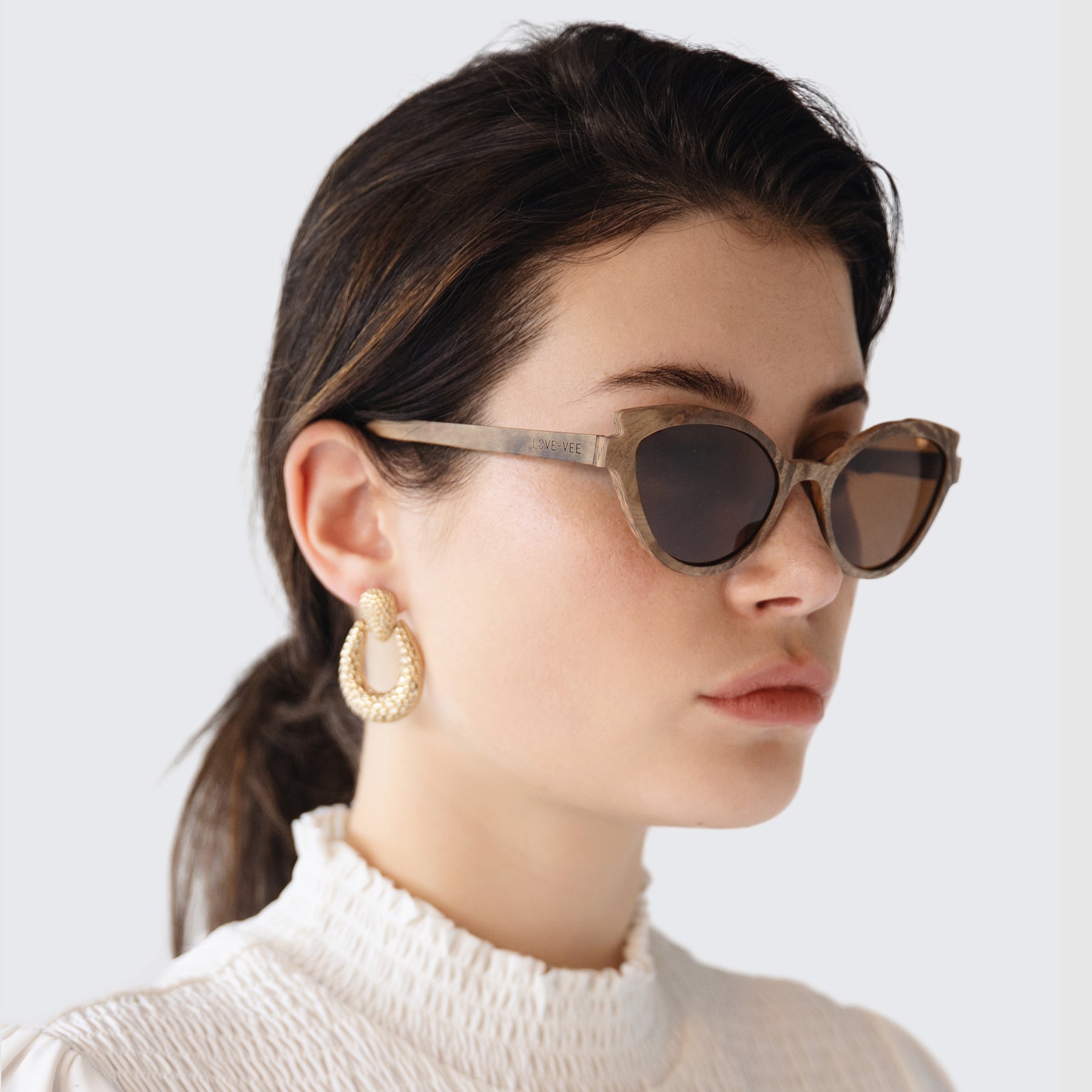 Light Brown Wood Sunglasses Styled With Earrings