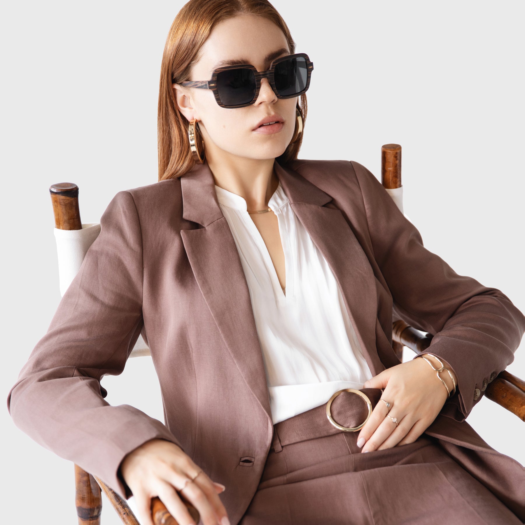 Ebony Brown Wood Square Sunglasses Styled Model On Director's Chair 