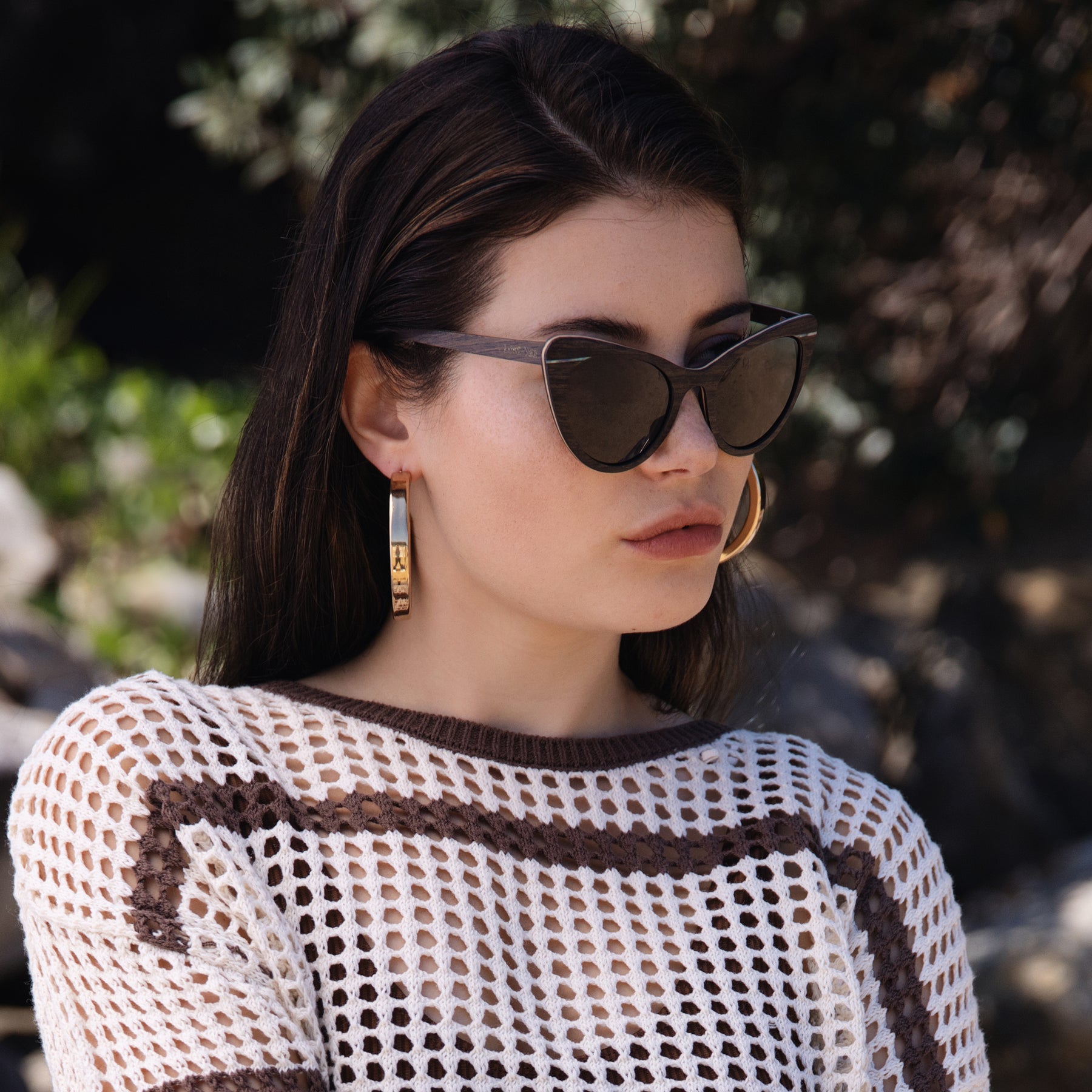 Dark Brown Wood Cat-Eye Sunglasses Styled On Beach With Net Jumper